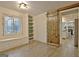 Open-concept dining room with built-in shelving, a barn door, and light-colored flooring at 101 Nightwind Ct, Peachtree City, GA 30269