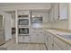 This kitchen features gray cabinets, stainless steel appliances, and butcher block countertops at 101 Nightwind Ct, Peachtree City, GA 30269