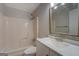 Bright bathroom with a shower-tub combo, sink with modern faucet, and vanity at 308 Tulipwood Sw Cir, Conyers, GA 30094