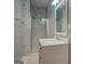 Bright bathroom with marble tile shower and modern vanity at 308 Tulipwood Sw Cir, Conyers, GA 30094