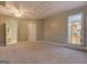 Large carpeted bonus room with access to the bathroom and kitchen at 308 Tulipwood Sw Cir, Conyers, GA 30094