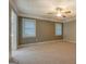 Spacious bedroom with neutral carpet and paint, with bright windows at 308 Tulipwood Sw Cir, Conyers, GA 30094