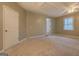 Carpeted bonus room features closet, ceiling fan and access to the bathroom at 308 Tulipwood Sw Cir, Conyers, GA 30094