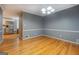 Gray dining room features wood flooring with a stainless refrigerator visible in background at 308 Tulipwood Sw Cir, Conyers, GA 30094