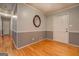 Hallway area features hardwood floors, decorative mirrors, and neutral, two-tone paint at 308 Tulipwood Sw Cir, Conyers, GA 30094