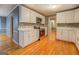 Kitchen with stainless steel appliances, white cabinets and updated tile backsplash at 308 Tulipwood Sw Cir, Conyers, GA 30094