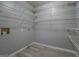 Large storage closet features wire shelving and laminate floors at 308 Tulipwood Sw Cir, Conyers, GA 30094