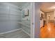 Large storage closet with wire shelving, adjacent to kitchen at 308 Tulipwood Sw Cir, Conyers, GA 30094