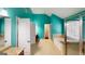Bright Primary bathroom features a granite vanity, soaking tub, a seamless glass shower and turquoise colored walls at 100 Windmeadow Way, Fayetteville, GA 30214