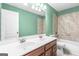 Bathroom with a double vanity, tile shower and bathtub at 100 Windmeadow Way, Fayetteville, GA 30214