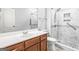 Bright bathroom featuring a tile shower, marble countertop, and a white toilet at 100 Windmeadow Way, Fayetteville, GA 30214