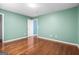 Bedroom with hardwood floors and light blue walls at 100 Windmeadow Way, Fayetteville, GA 30214