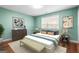 Bedroom with a light blue wall, hardwood floor and decor at 100 Windmeadow Way, Fayetteville, GA 30214
