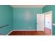 Bright bedroom with neutral walls and hardwood floors ready for customization at 100 Windmeadow Way, Fayetteville, GA 30214