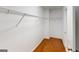 This walk-in closet features white wire shelving and hardwood floors at 100 Windmeadow Way, Fayetteville, GA 30214