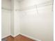 This walk-in closet features white wire shelving and hardwood floors at 100 Windmeadow Way, Fayetteville, GA 30214