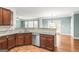 Spacious kitchen with stainless steel appliances, granite countertops, and hardwood floors at 100 Windmeadow Way, Fayetteville, GA 30214