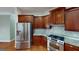 Modern kitchen with stainless steel appliances and beautiful countertops at 100 Windmeadow Way, Fayetteville, GA 30214