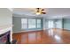 Spacious living area with fireplace, hardwood floors, and natural light at 100 Windmeadow Way, Fayetteville, GA 30214