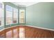 Inviting living room features lots of light from the many windows and hardwood floors at 100 Windmeadow Way, Fayetteville, GA 30214