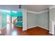 Bright living room with hardwood floors, stairs, and unique color scheme at 100 Windmeadow Way, Fayetteville, GA 30214