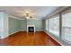 Large living area with hardwood floors, fireplace, and great natural light at 100 Windmeadow Way, Fayetteville, GA 30214