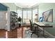 Bright home office with a large bay window and streamlined desk arrangement at 100 Windmeadow Way, Fayetteville, GA 30214