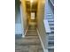 Bright hallway featuring neutral walls, hardwood floors and stairs leading up to the second floor at 801 Winbrook Dr, Mcdonough, GA 30253