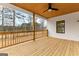 Inviting back porch featuring wood flooring, ceiling, white trim, and a ceiling fan to enjoy the outdoors at 130 Windchime Way # 9, Tyrone, GA 30290