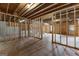 Unfinished basement with exposed wooden framing and concrete flooring, offering potential for customization and increased property value at 130 Windchime Way # 9, Tyrone, GA 30290