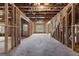 Unfinished basement with exposed wooden framing and concrete flooring, offering potential for customization and increased property value at 130 Windchime Way # 9, Tyrone, GA 30290
