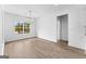 Sunny dining area with hardwood floors, a modern chandelier, and large windows at 130 Windchime Way # 9, Tyrone, GA 30290