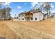 Exterior elevation of house featuring a walkout basement and back porch at 130 Windchime Way # 9, Tyrone, GA 30290
