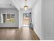 Bright foyer with hardwood floors, featuring an elegant light fixture and expansive views at 130 Windchime Way # 9, Tyrone, GA 30290