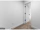 Hallway with carpet flooring leading to an open door at 130 Windchime Way # 9, Tyrone, GA 30290