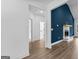 Bright living space with a cozy fireplace and hardwood floors, blending style and comfort at 130 Windchime Way # 9, Tyrone, GA 30290