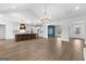 Spacious open-concept layout features hardwood floors, a kitchen, and modern light fixtures at 130 Windchime Way # 9, Tyrone, GA 30290
