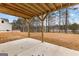 Covered patio area looking out onto the lake and backyard at 130 Windchime Way # 9, Tyrone, GA 30290