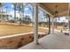Inviting porch area with detailed columns and a tranquil view of the surrounding landscape at 130 Windchime Way # 9, Tyrone, GA 30290