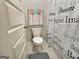 Toilet with decorative shower curtain and colorful towels at 3092 Cedar Crest Way, Decatur, GA 30034