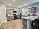 Modern kitchen featuring granite countertops, sleek gray cabinetry, and updated appliances at 3092 Cedar Crest Way, Decatur, GA 30034