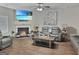 Cozy living room featuring a fireplace, ceiling fan, and comfortable leather seating at 3092 Cedar Crest Way, Decatur, GA 30034