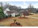 Aerial view showcasing the property, surrounding neighborhood, and landscaped yards at 9135 Woodhaven Way, Mcdonough, GA 30253