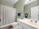 Cozy bathroom with shower, sink, and a vanity that provides ample storage at 9135 Woodhaven Way, Mcdonough, GA 30253