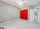 Neutral bedroom featuring ceiling fan, gray walls, and ensuite bathroom access at 9135 Woodhaven Way, Mcdonough, GA 30253