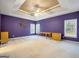 Spacious bedroom features tray ceiling, bright windows, and custom wall decor at 9135 Woodhaven Way, Mcdonough, GA 30253