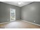 Clean bedroom with natural light and a view of the neighborhood at 9135 Woodhaven Way, Mcdonough, GA 30253