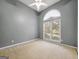 Neutral bedroom with large window, ceiling fan, and neutral carpet at 9135 Woodhaven Way, Mcdonough, GA 30253