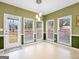 Inviting dining area with big windows offering backyard views and outdoor access at 9135 Woodhaven Way, Mcdonough, GA 30253