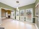 Bright dining area with big windows, view to outdoor space and modern lighting at 9135 Woodhaven Way, Mcdonough, GA 30253